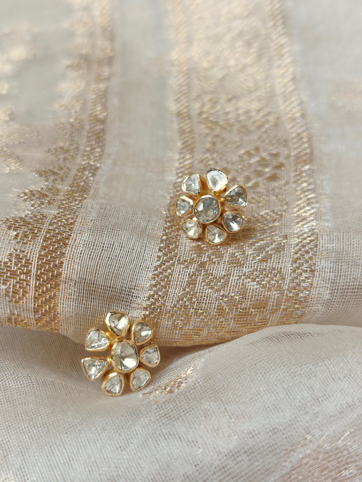 14K gold small diamond polki earrings on beige fabric