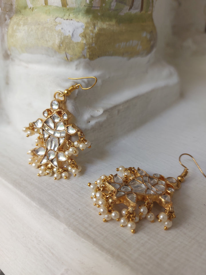 Gold plated kundan fish earrings close-up detail