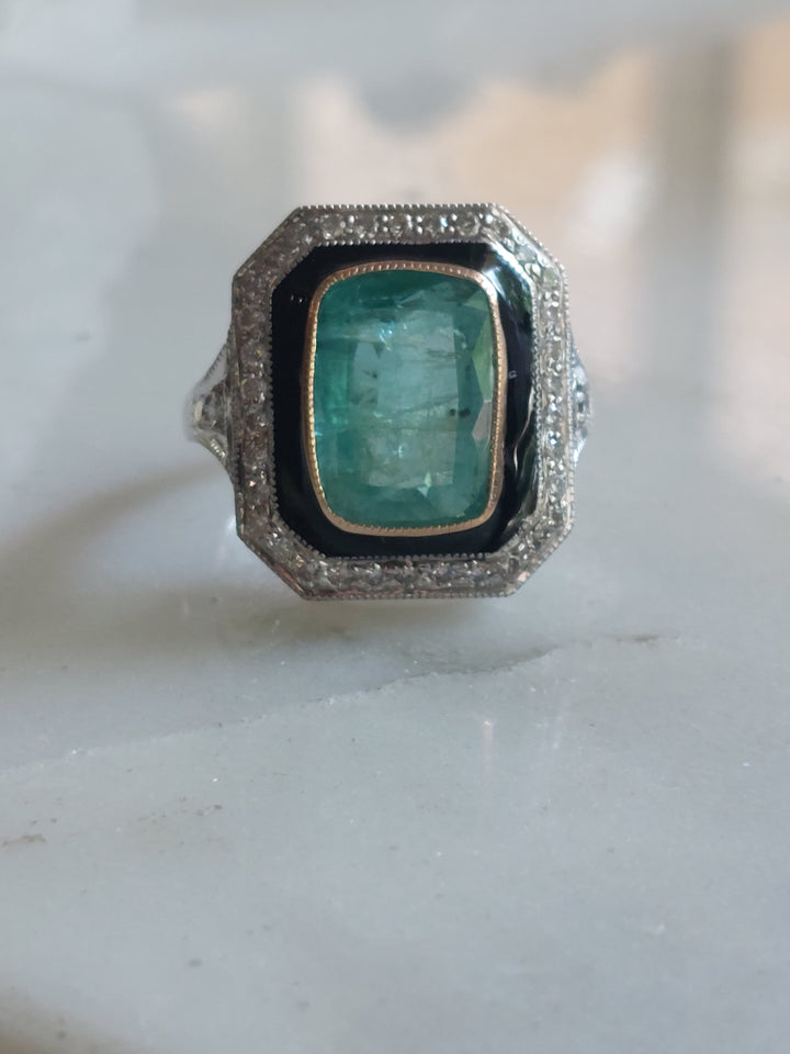Art Deco ring rectangular emerald gold bezel black enamel