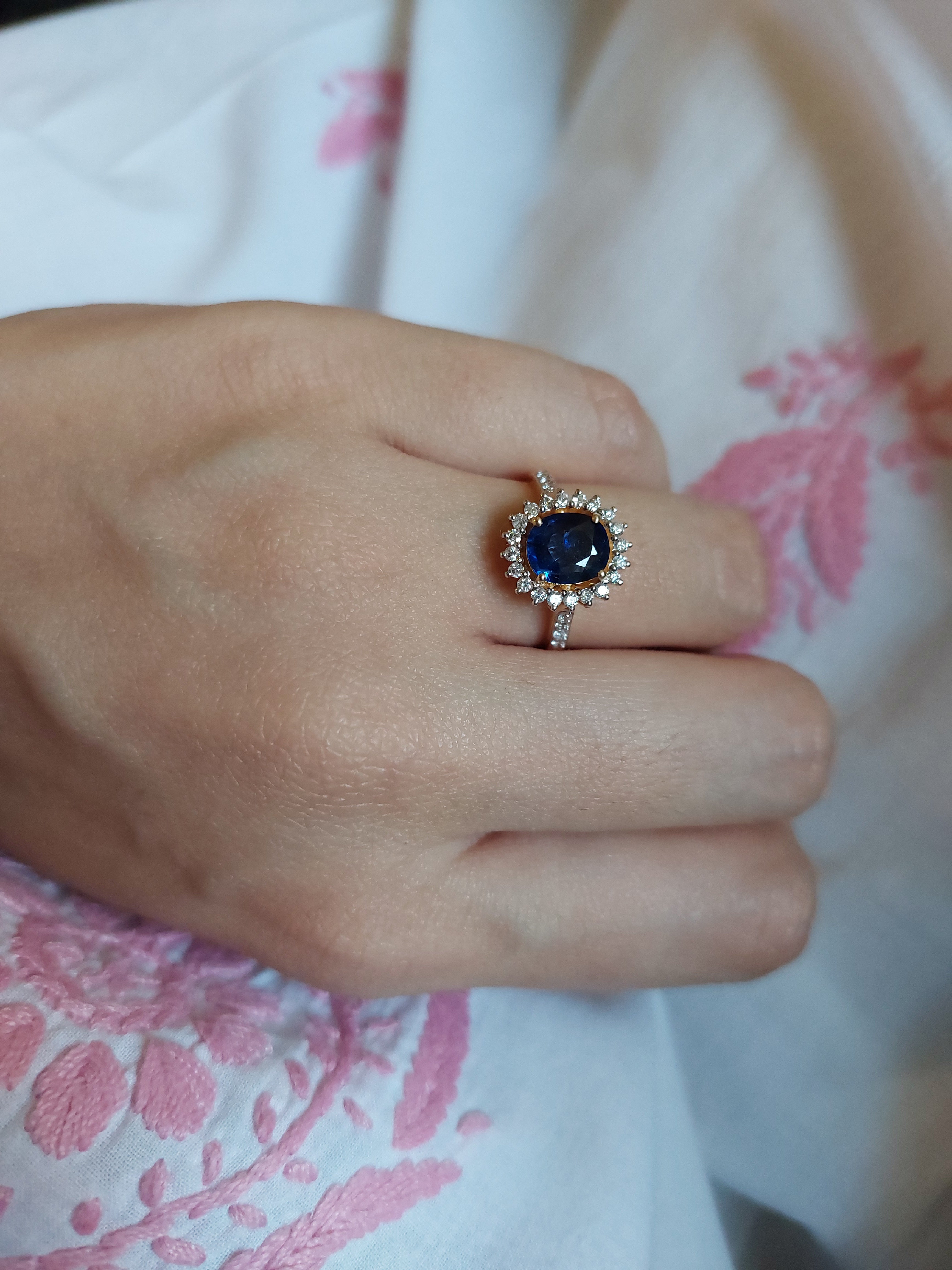 14K gold blue sapphire ring with pave diamond detailing