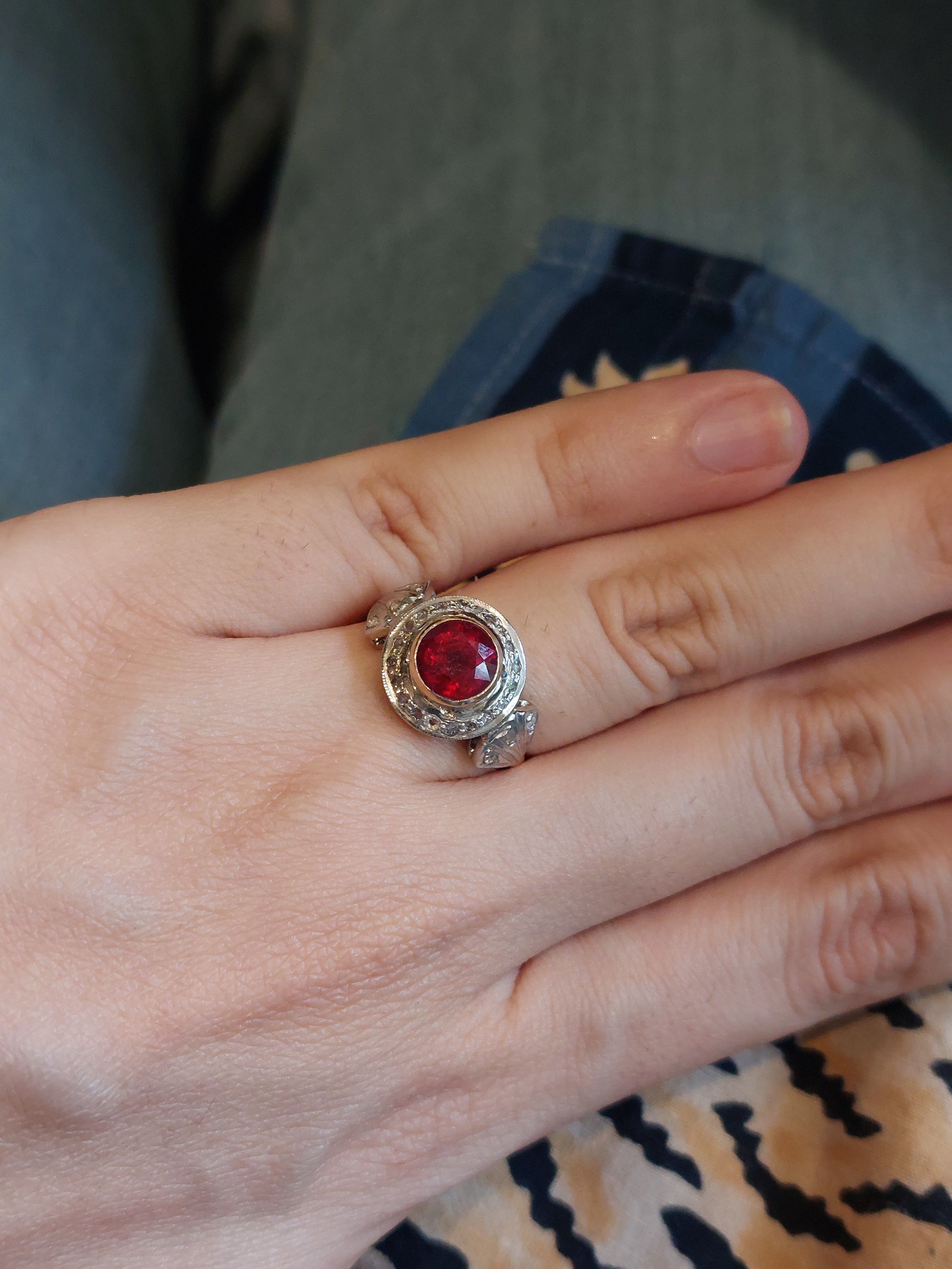 14K gold ruby ring intricate design worn on finger