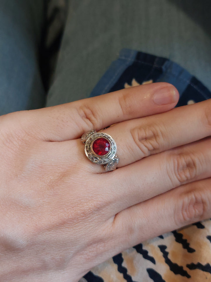 14K gold ruby ring intricate design worn on finger