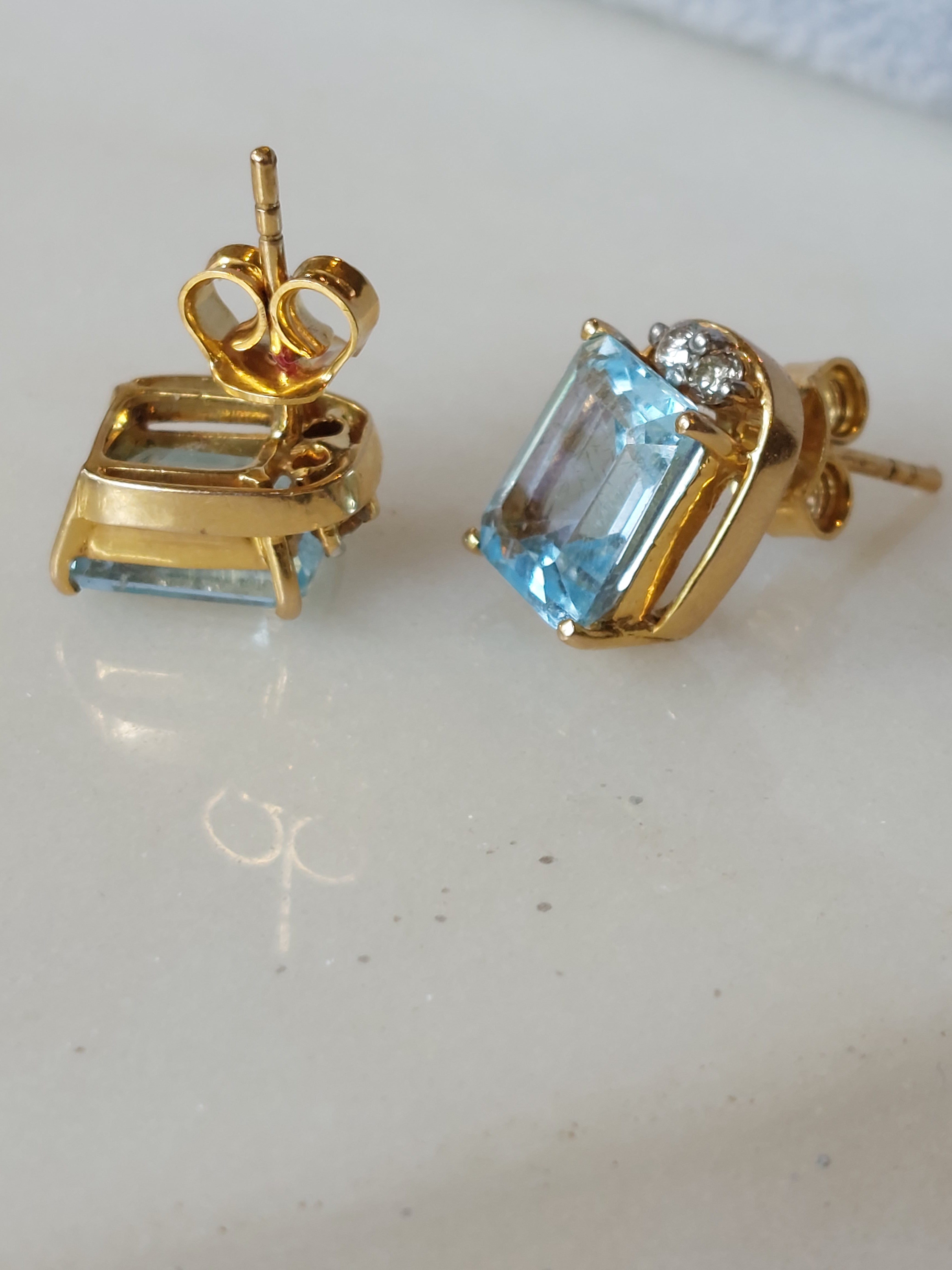 14K gold blue topaz earrings open-prong setting
