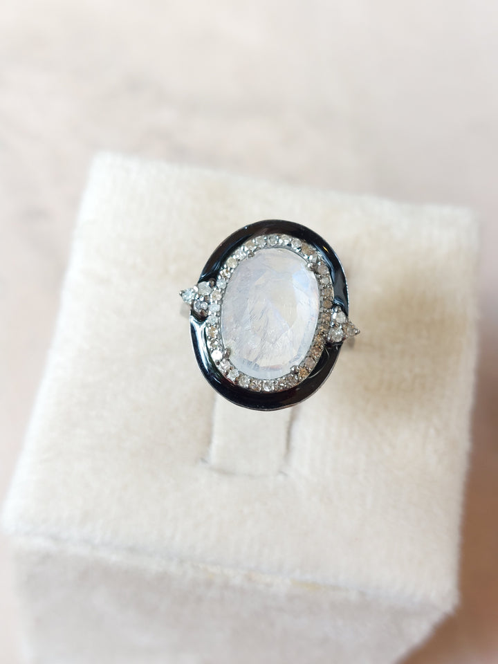 Moonstone diamond enamel ring close-up on model
