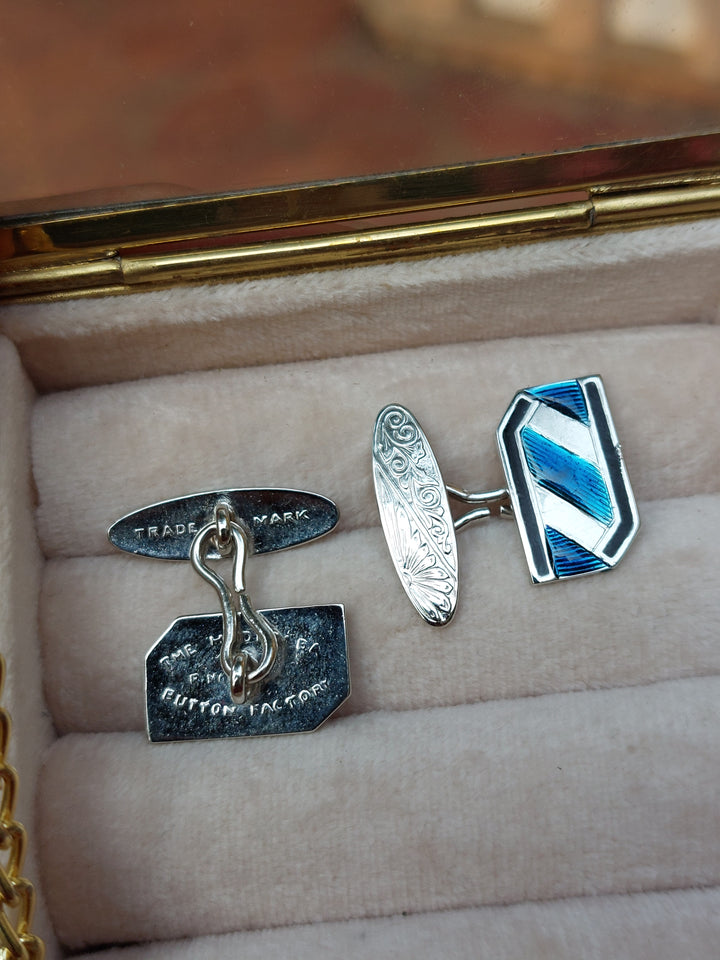 Vintage brass enamel cufflinks close-up detail