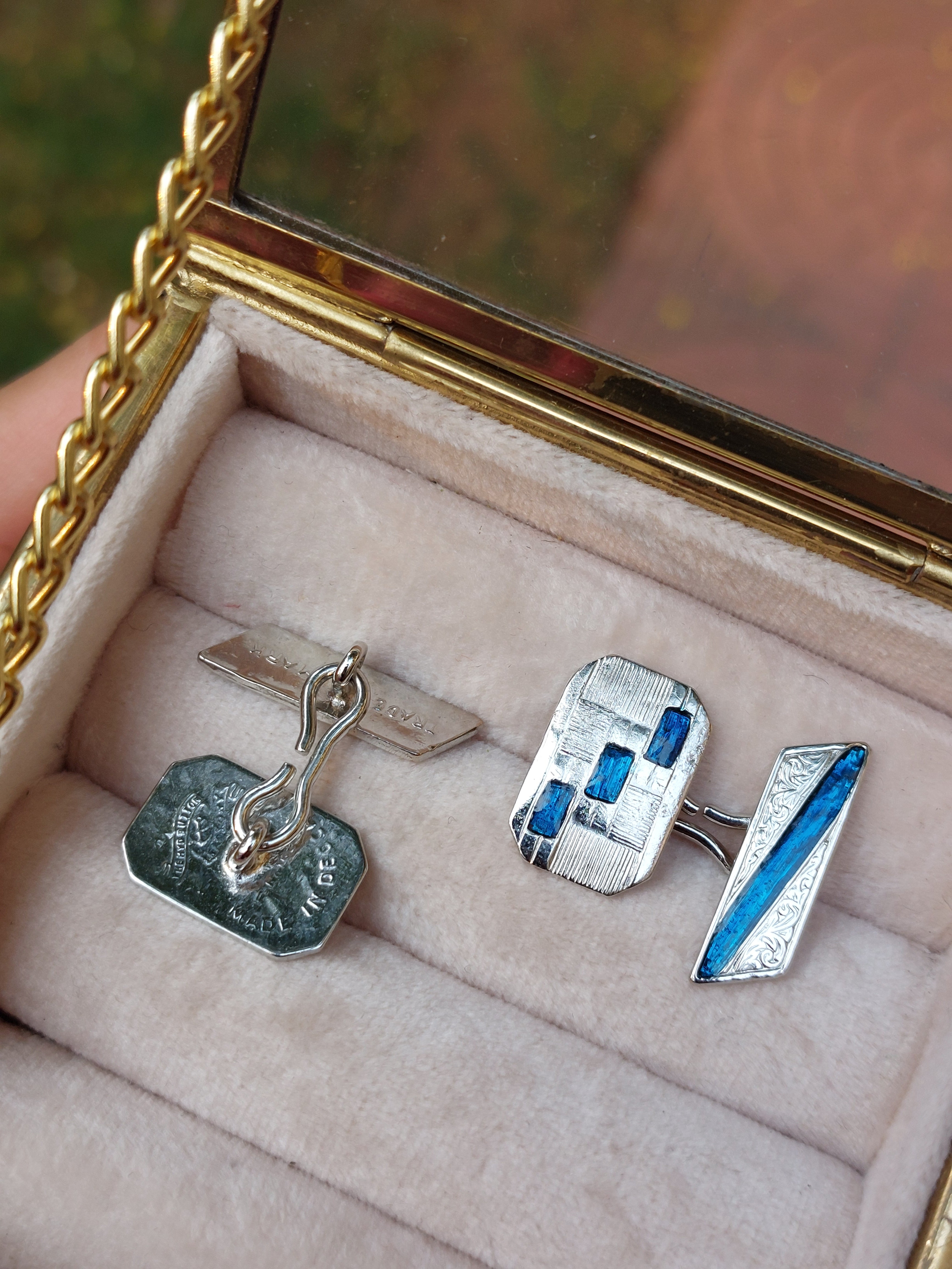 Vintage brass enamel cufflinks close-up detail