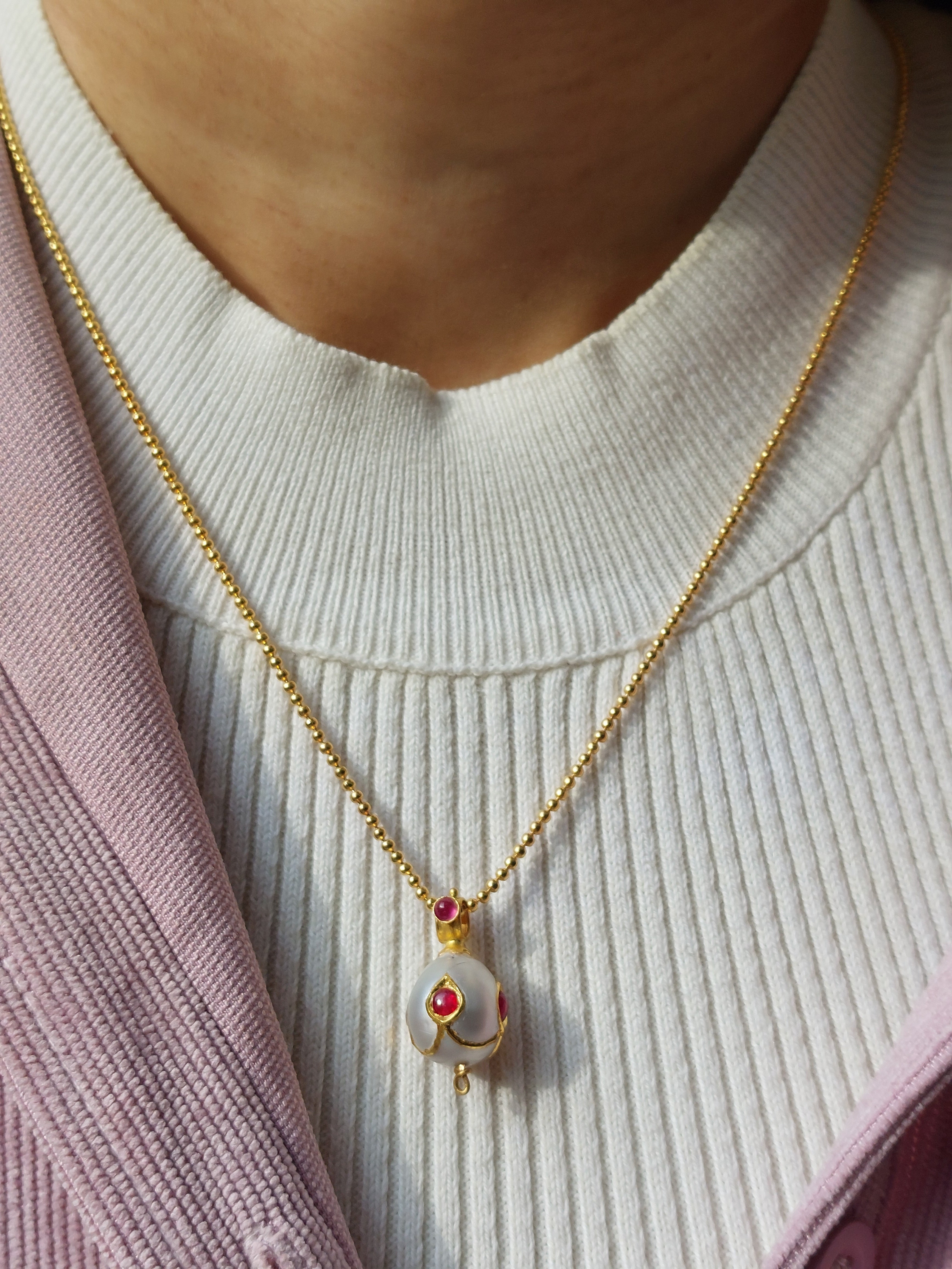 22K gold ruby South Sea pearl pendant close-up angle