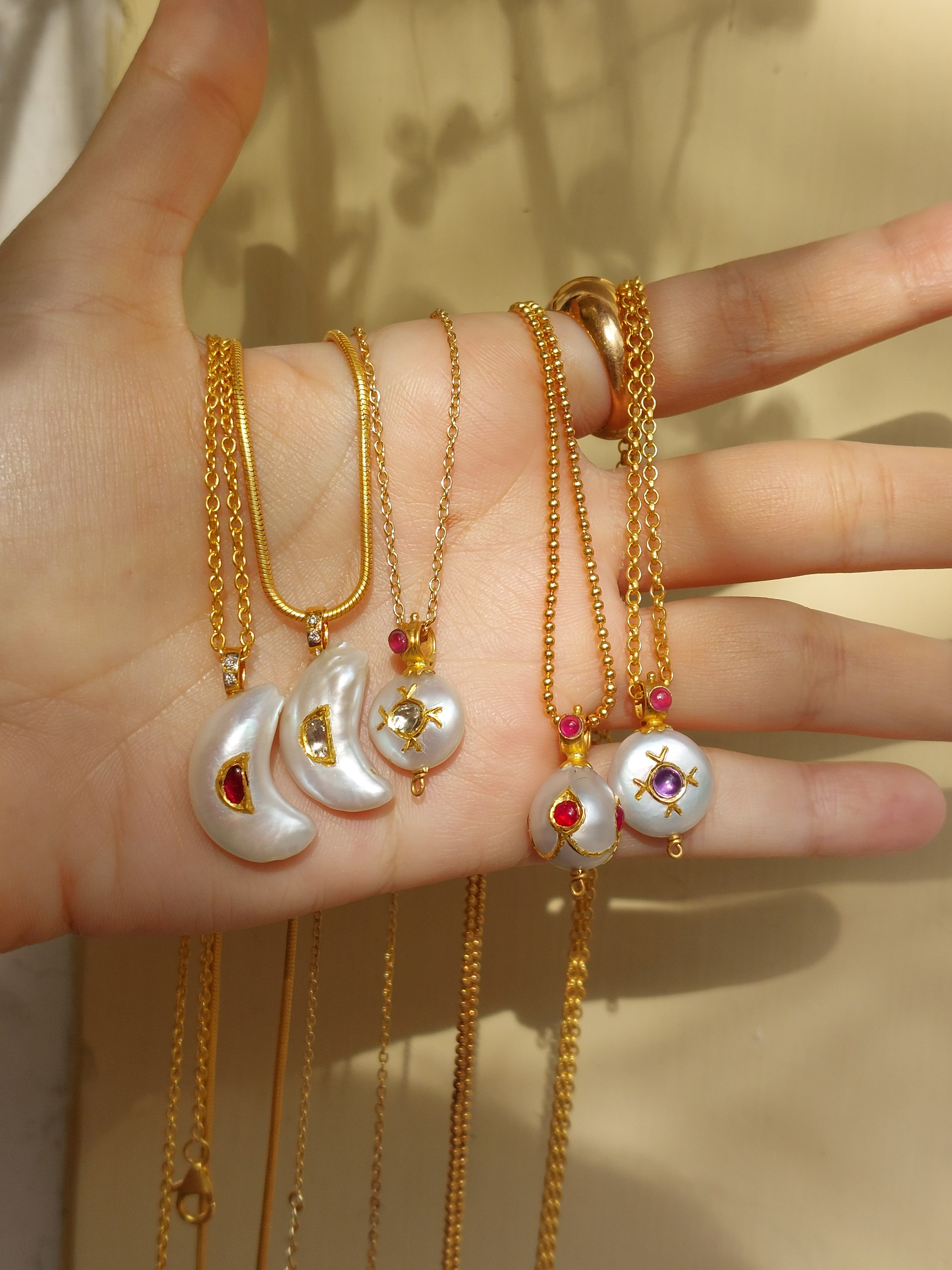 Gold pearl diamond pendant on chain