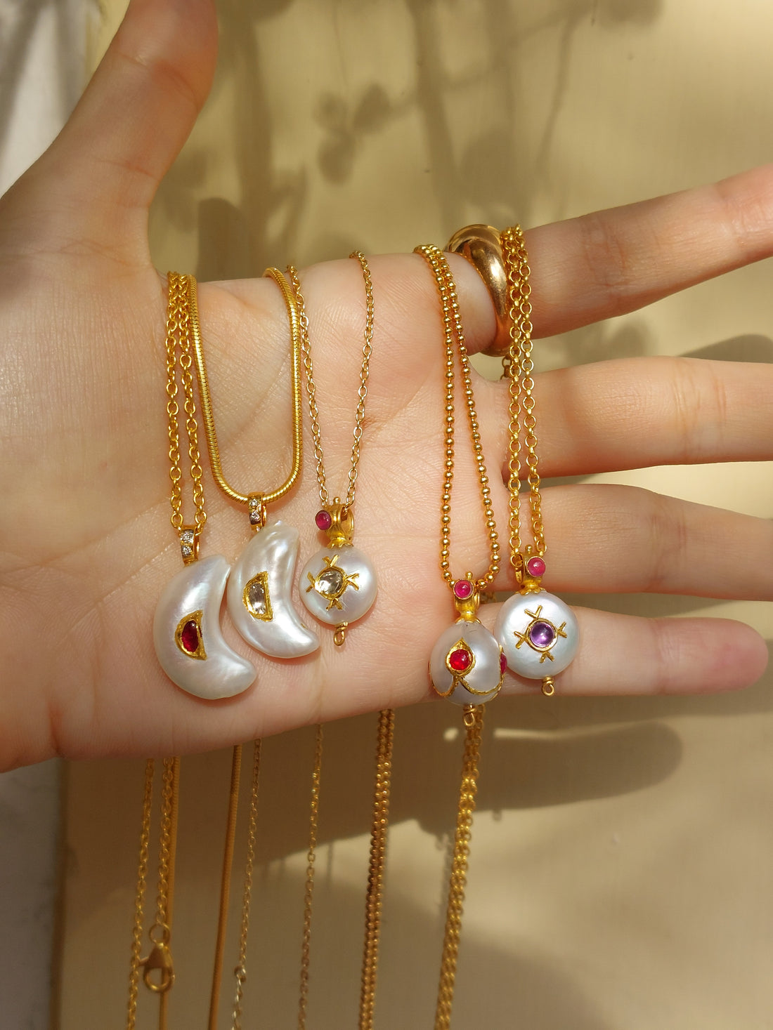 Gold pearl diamond pendant on chain