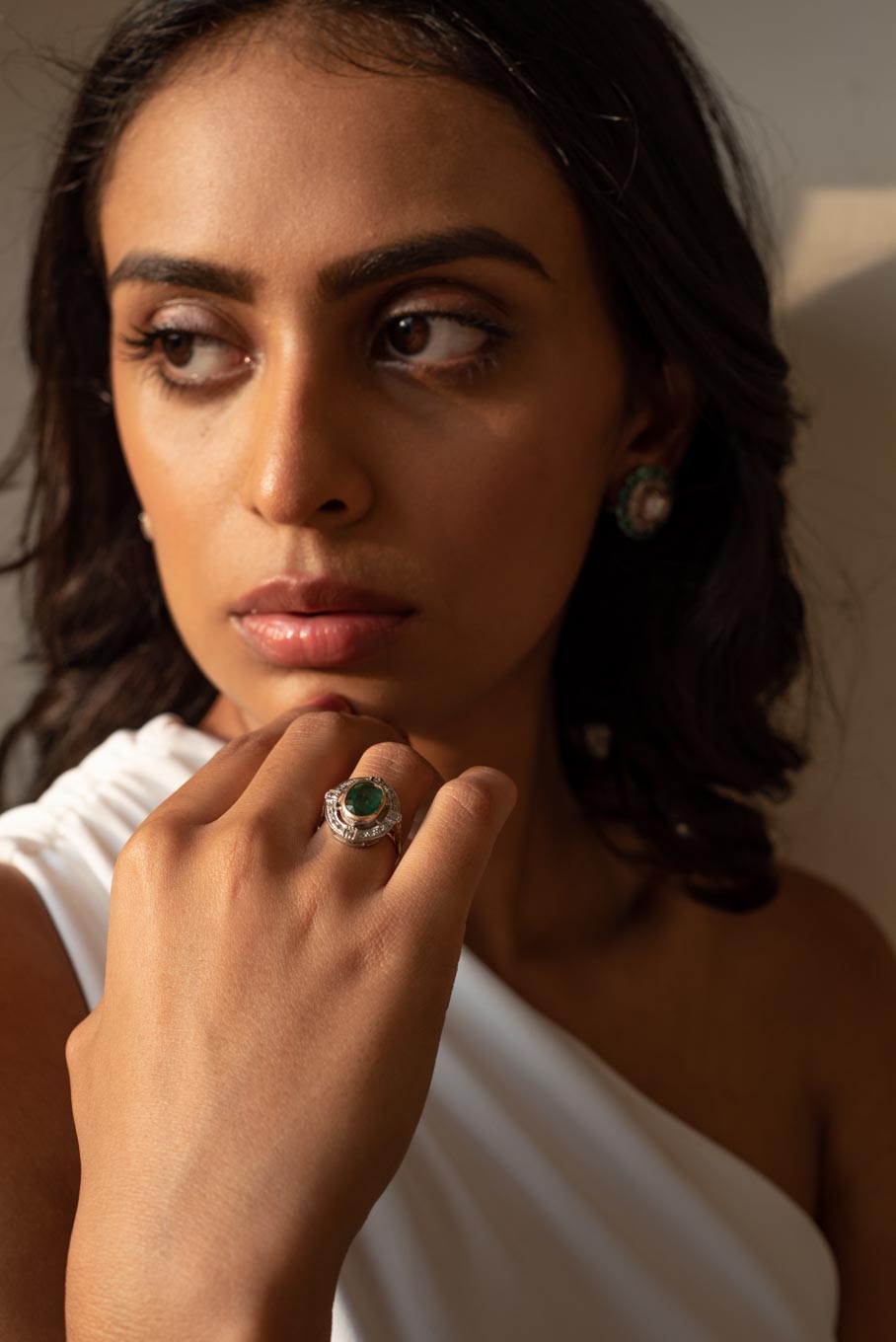 14K gold Art Deco emerald ring on hand