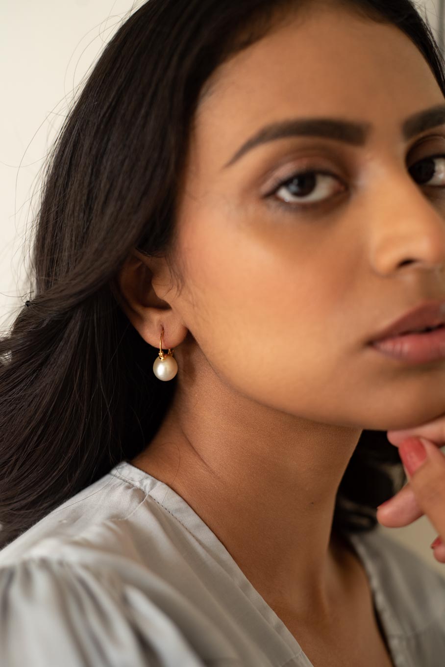 14K gold single pearl drop earrings worn by model