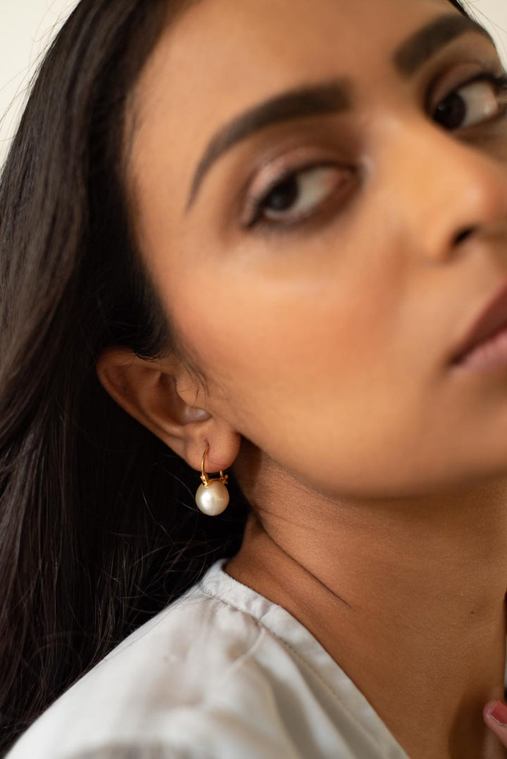 14K gold South Sea pearl drop earrings worn by model