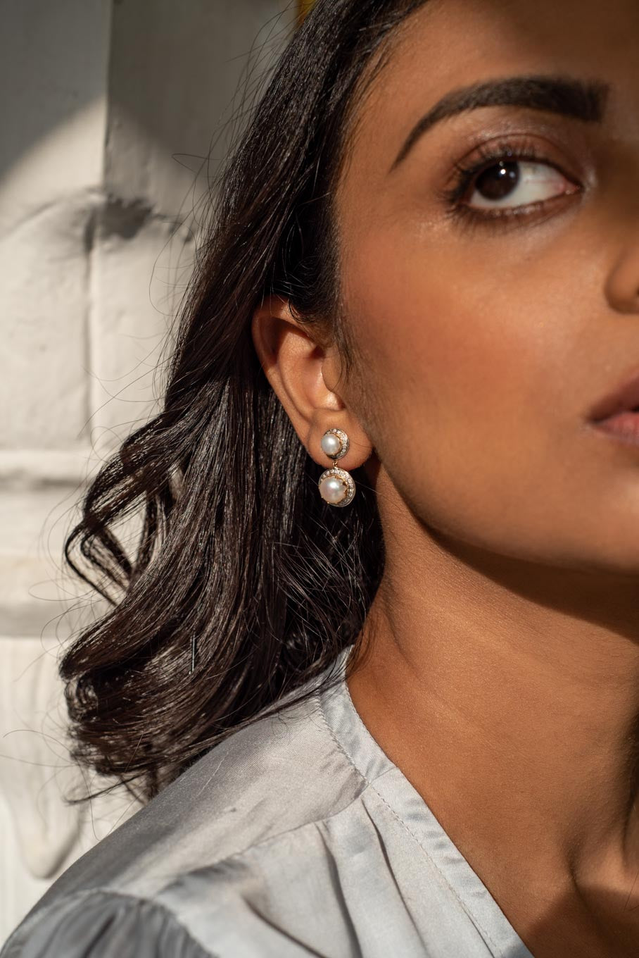 14K gold pearl drop earrings worn by model