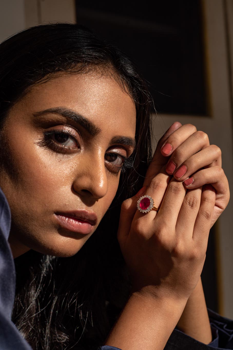 14K gold Rabia Ring oval ruby center stone on woman's hand