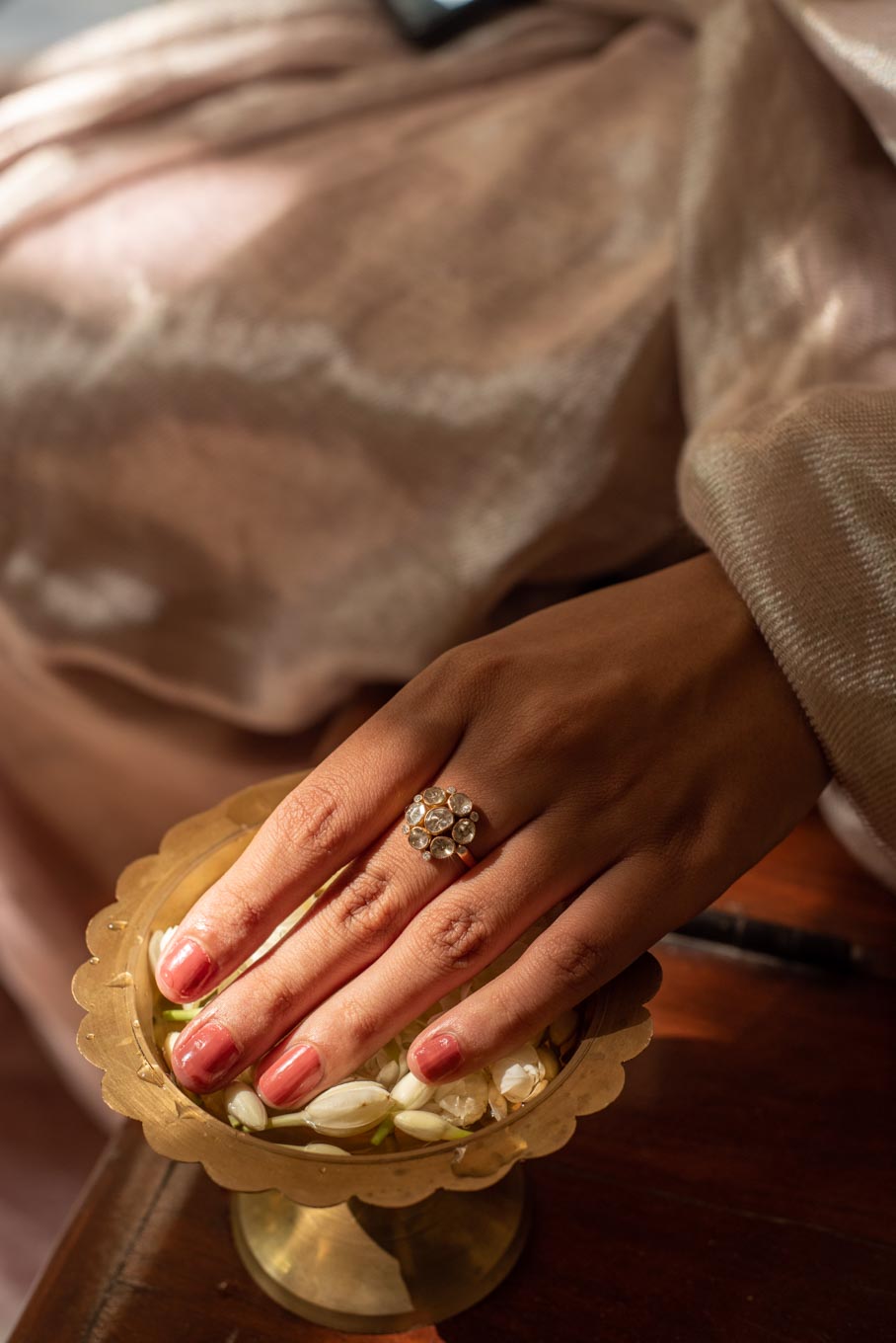 14K gold floral polki design ring on brass tray