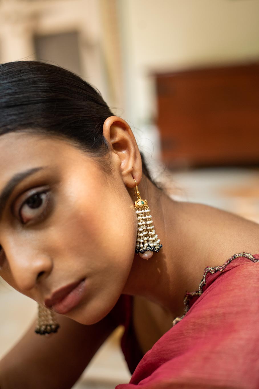 18K gold sapphire jhumka worn with coral outfit