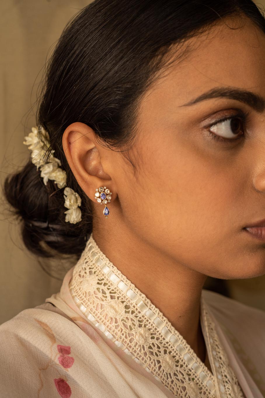 14K gold tanzanite polki earrings worn with cream outfit