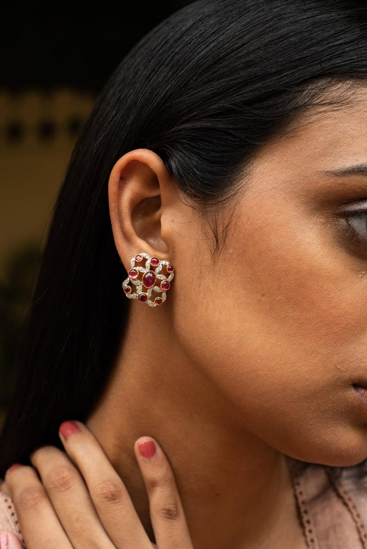 14K gold tourmaline floral earring with red gemstone accents