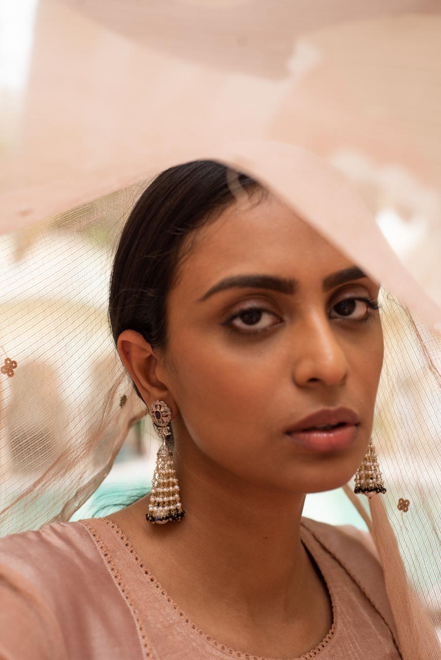 14K gold Laila earrings layered pearl clusters worn by model