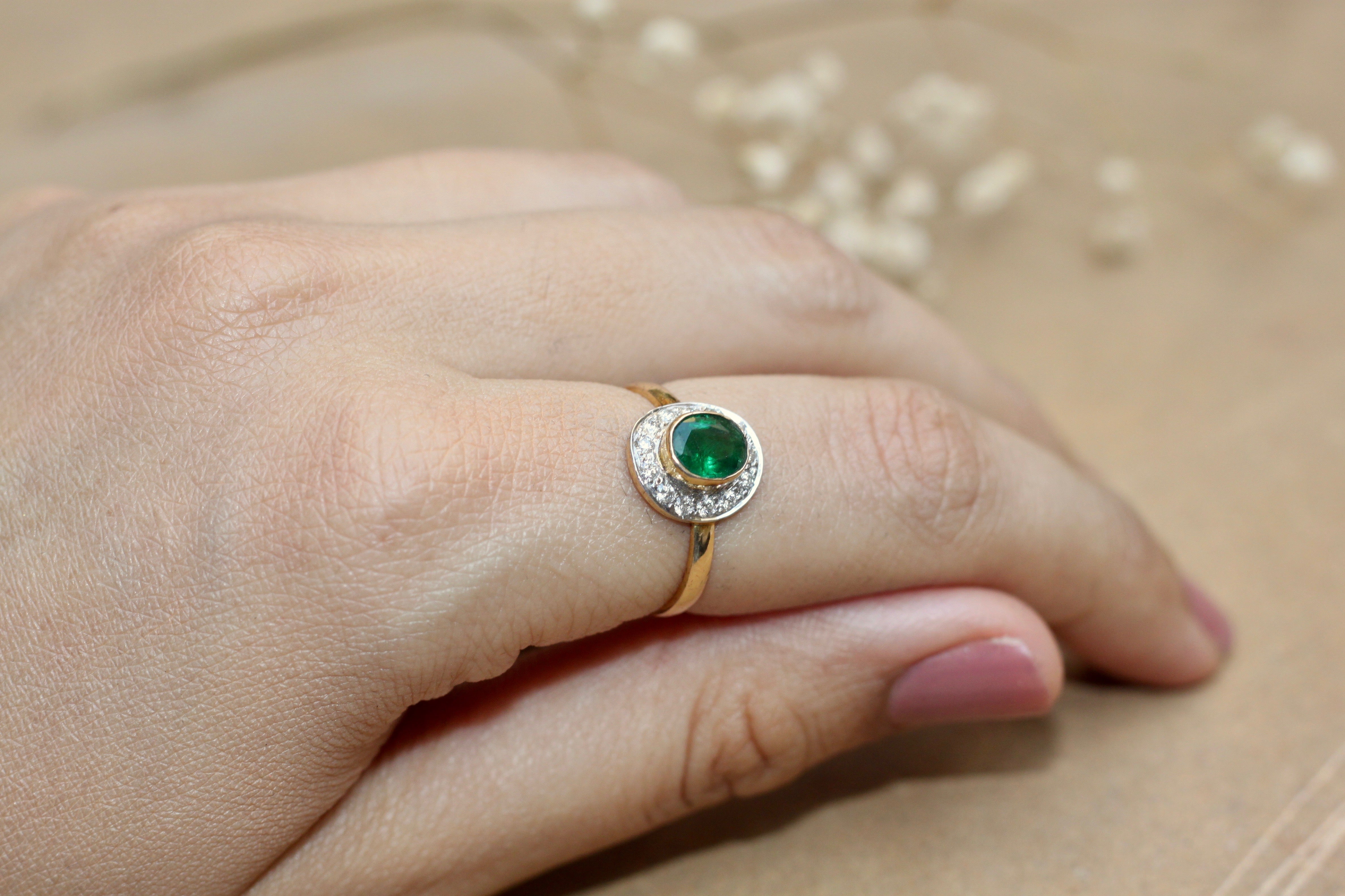 14K gold round emerald ring with diamond accents