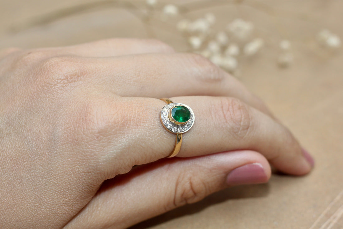 14K gold round emerald ring with diamond accents
