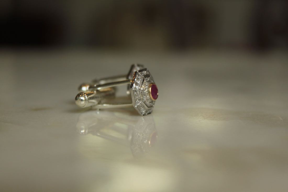 925 silver Art Deco ruby cufflinks on reflective surface
