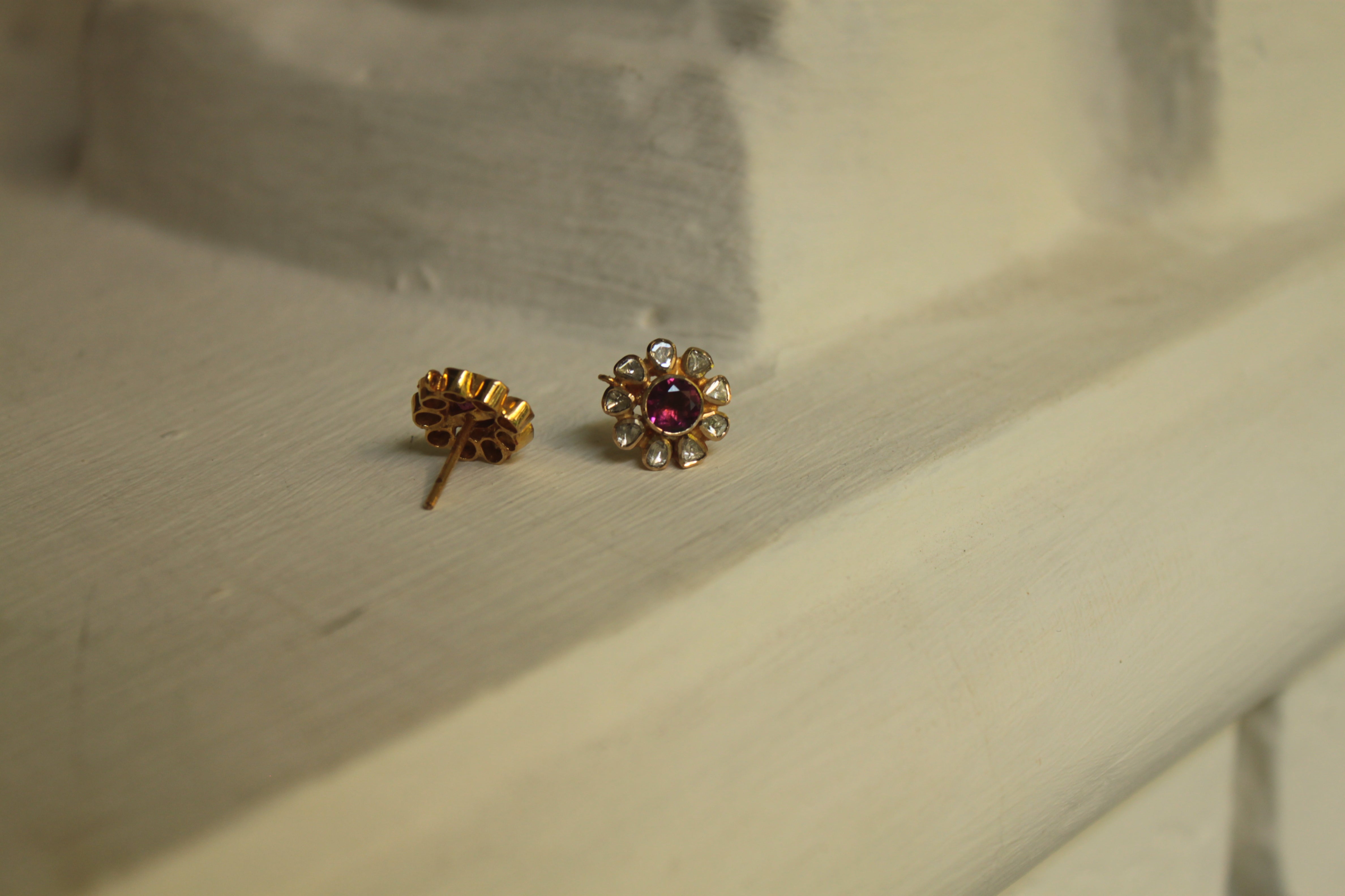 14K gold stud earrings with red gemstone center