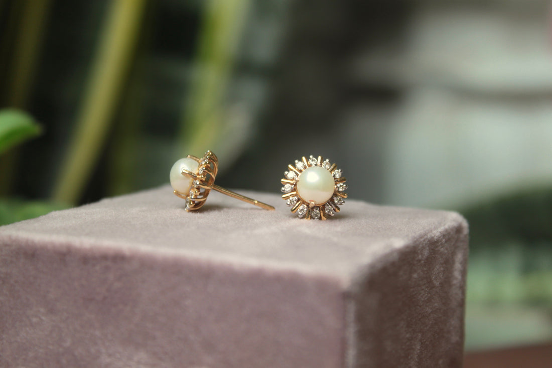 14K gold pearl earrings with decorative gold metalwork