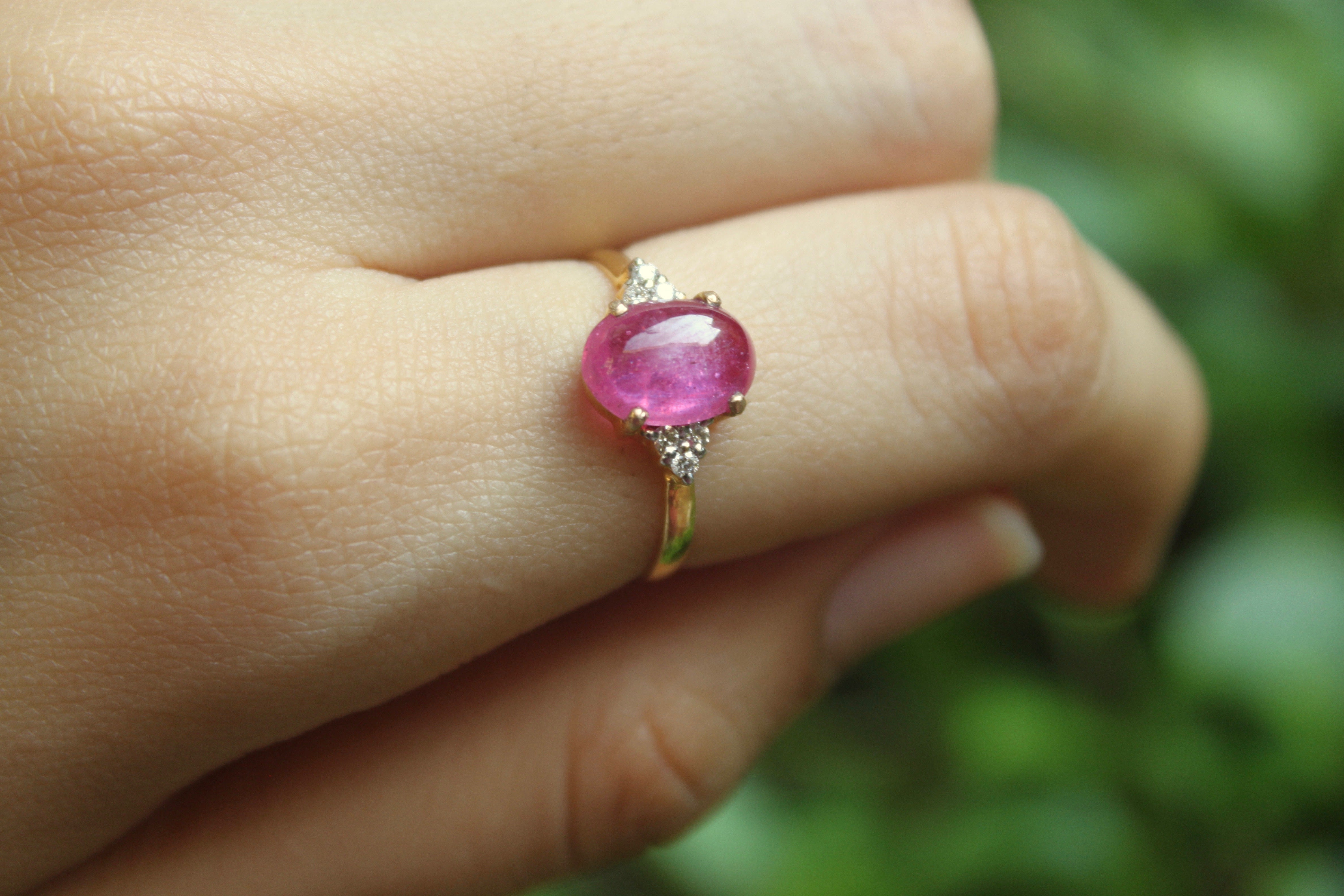 14K gold Nadeen Ring with oval ruby centerpiece on slender band