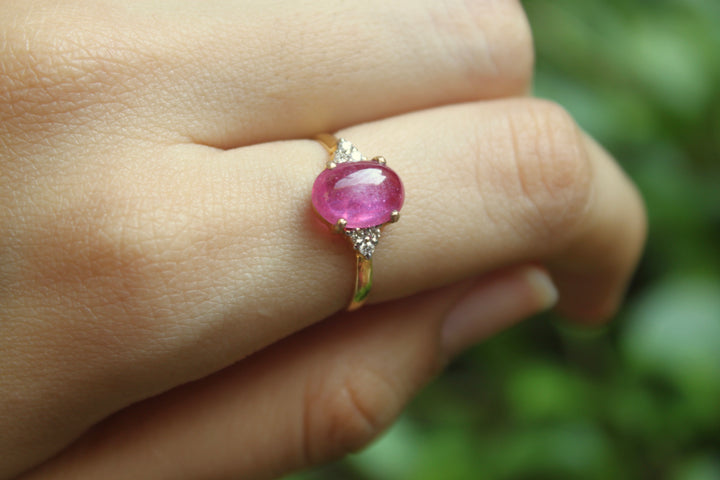 14K gold Nadeen Ring with oval ruby centerpiece on slender band