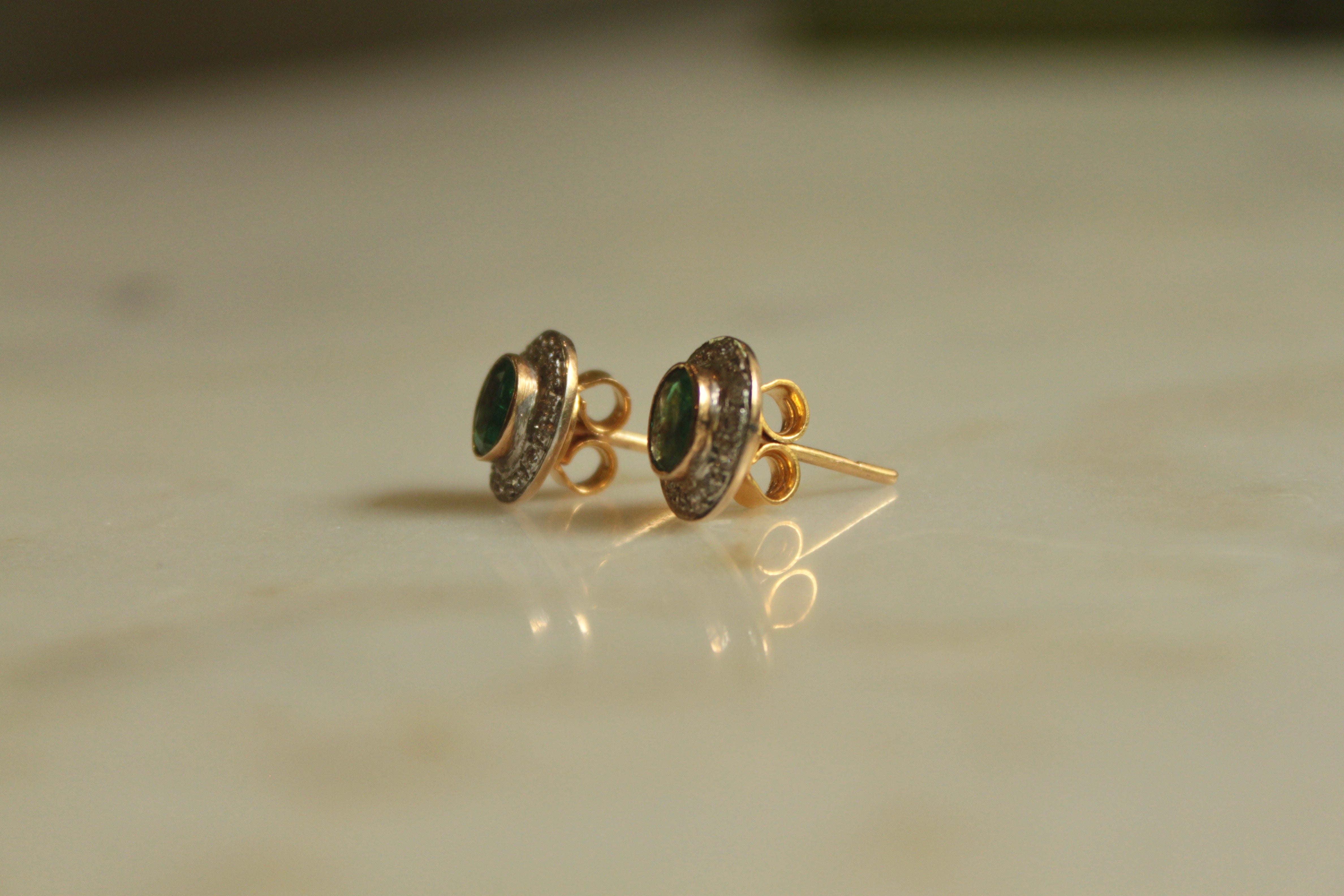 14K gold emerald earrings with diamond halo