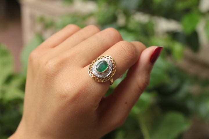 14K gold emerald ring oval center stone on finger