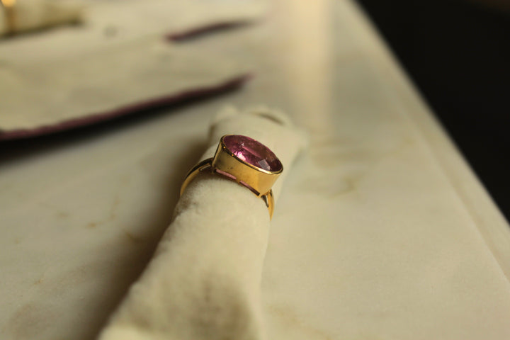 14K gold tourmaline ring with rectangular pink gemstone in a contemporary band design