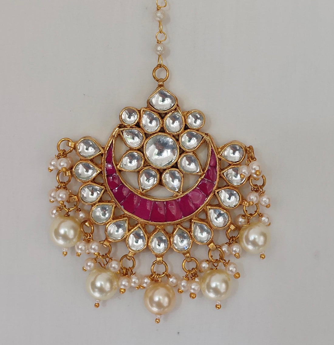 Silver alloy pink kundan tika product photo